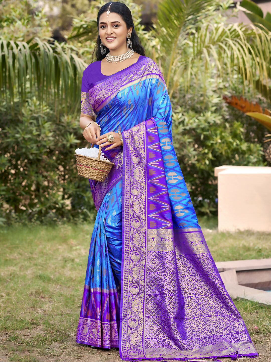 Sky blue Pochampally silk saree with matching blouse fabric displayed on a neutral background