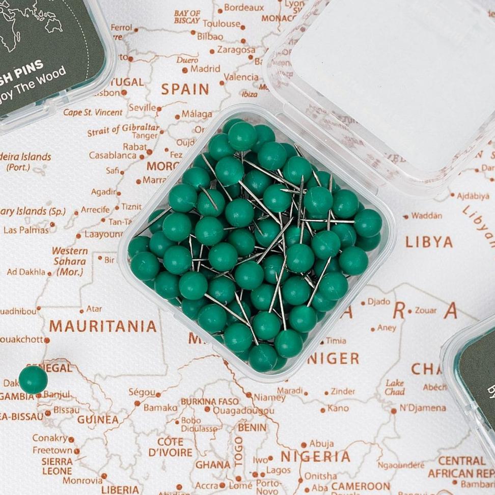 Refreshing green push pins for marking locations on a canvas wall map