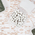 Minimalist white push pins used to mark locations on a canvas wall map
