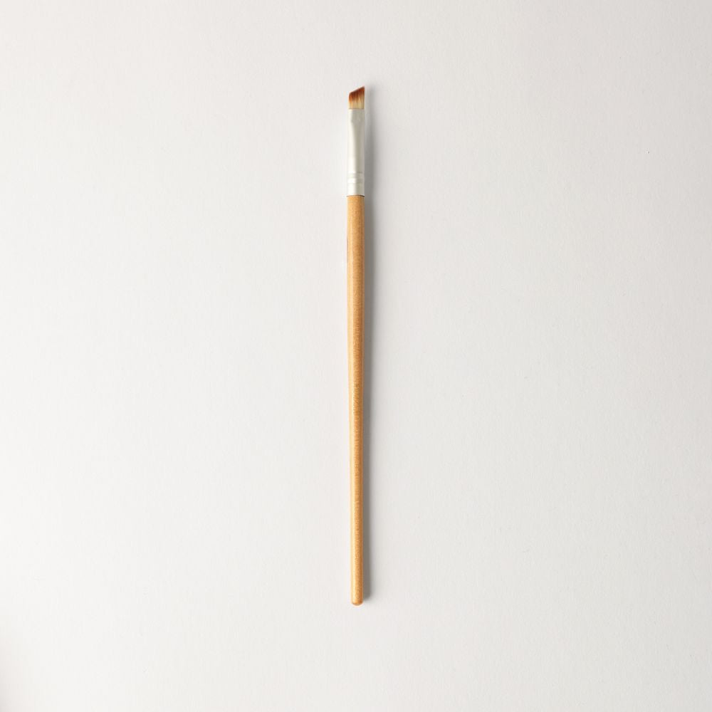 Brown and silver angled makeup brush for precise eyeliner application