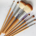 Set of 8 professional vegan makeup brushes in tan, silver, and cream