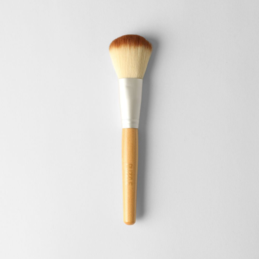 Soft beige and silver powder brush for smooth makeup application