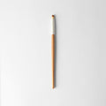 Small round eyeshadow brush with brown and silver handle