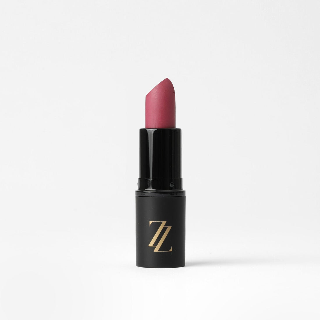 Satin finish vegan lipstick in pink, nude, and fuchsia shades.