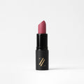 Satin finish vegan lipstick in pink, nude, and fuchsia shades.