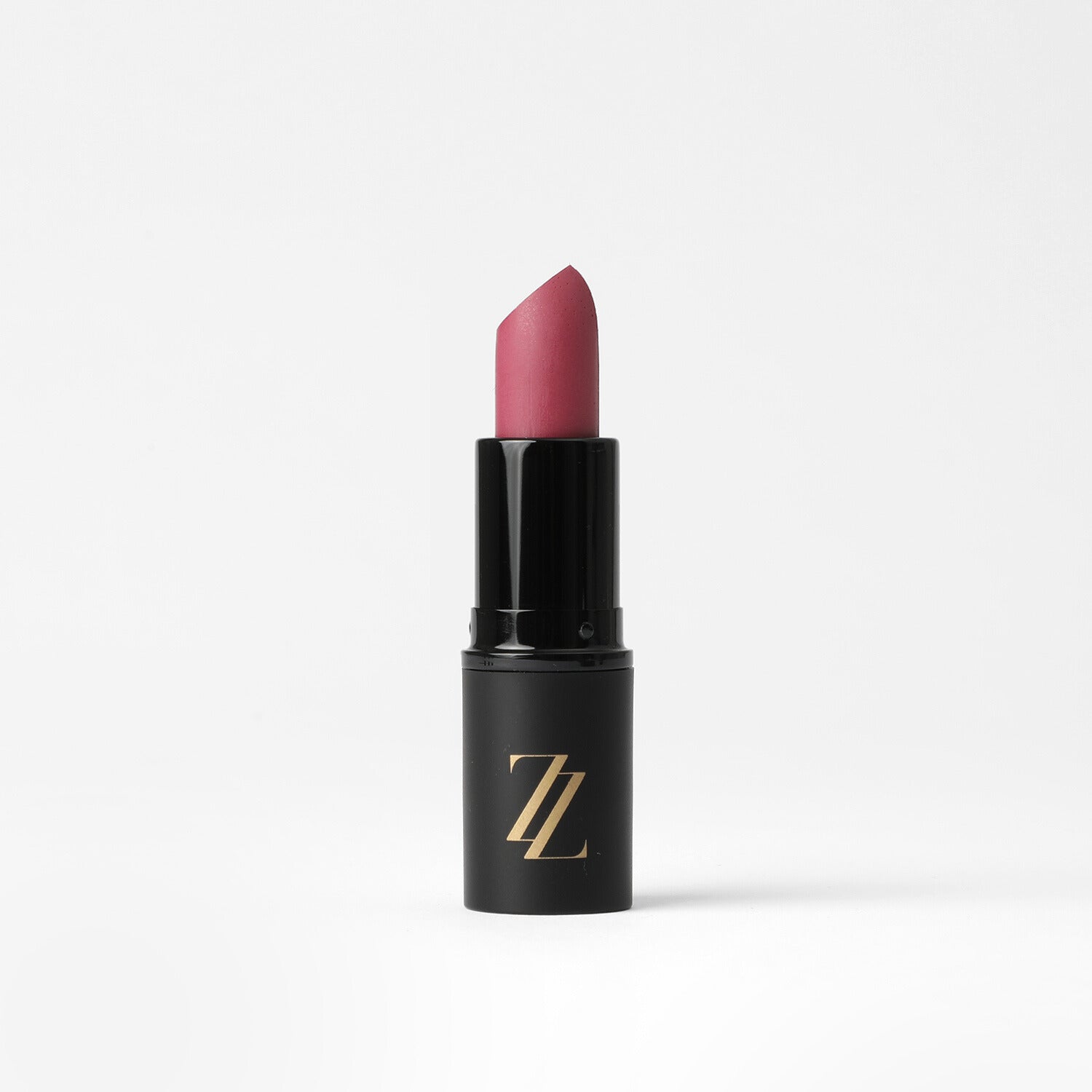 Satin finish vegan lipstick in pink, nude, and fuchsia shades.