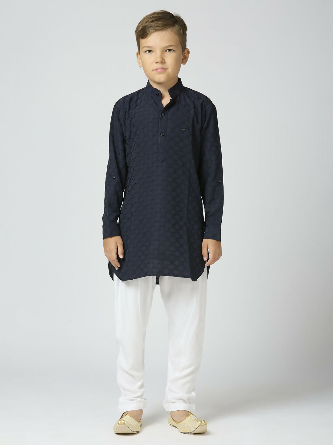 Young boy wearing a Navy Blue textured cotton kurta and pyjama set for a festive event