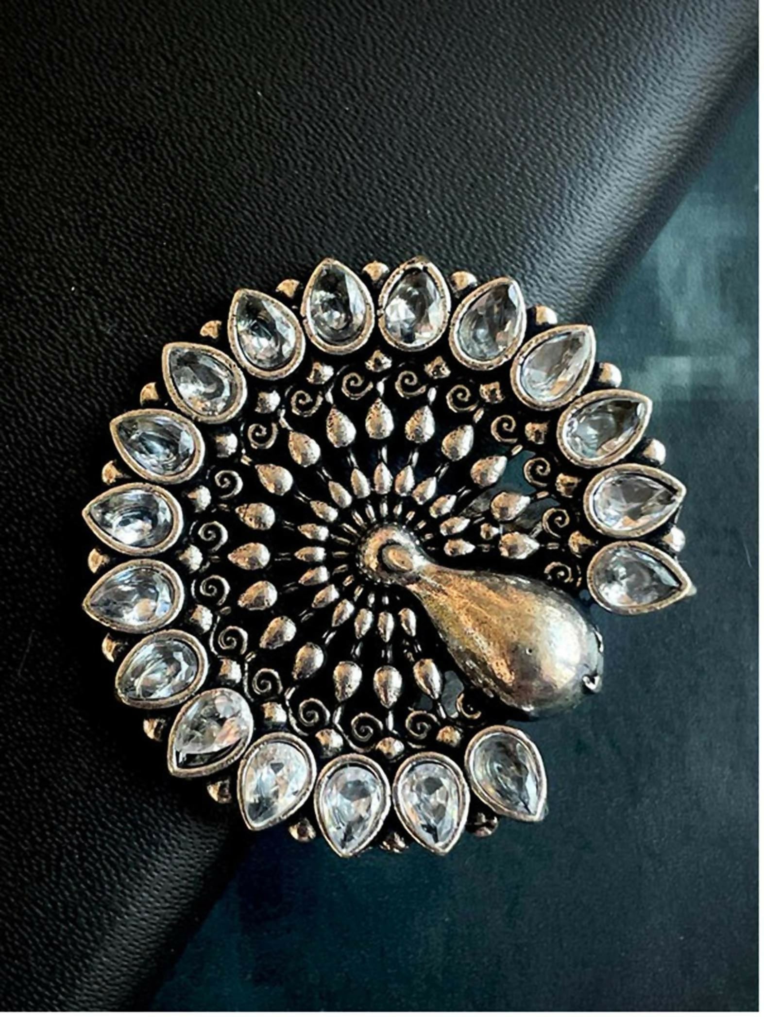 Silver-plated peacock shape ring with a vibrant Monalisa stone viewed from the top
