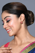 Elegant brass and Kundan earrings featuring ruby stones for traditional ethnic wear