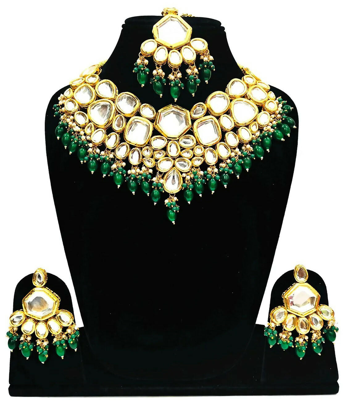 A luxurious green Kundan stone studded jewellery set with gold-plated alloy finish on a neutral background.