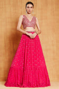 Rani pink faux georgette lehenga choli with zari and sequin embroidery details