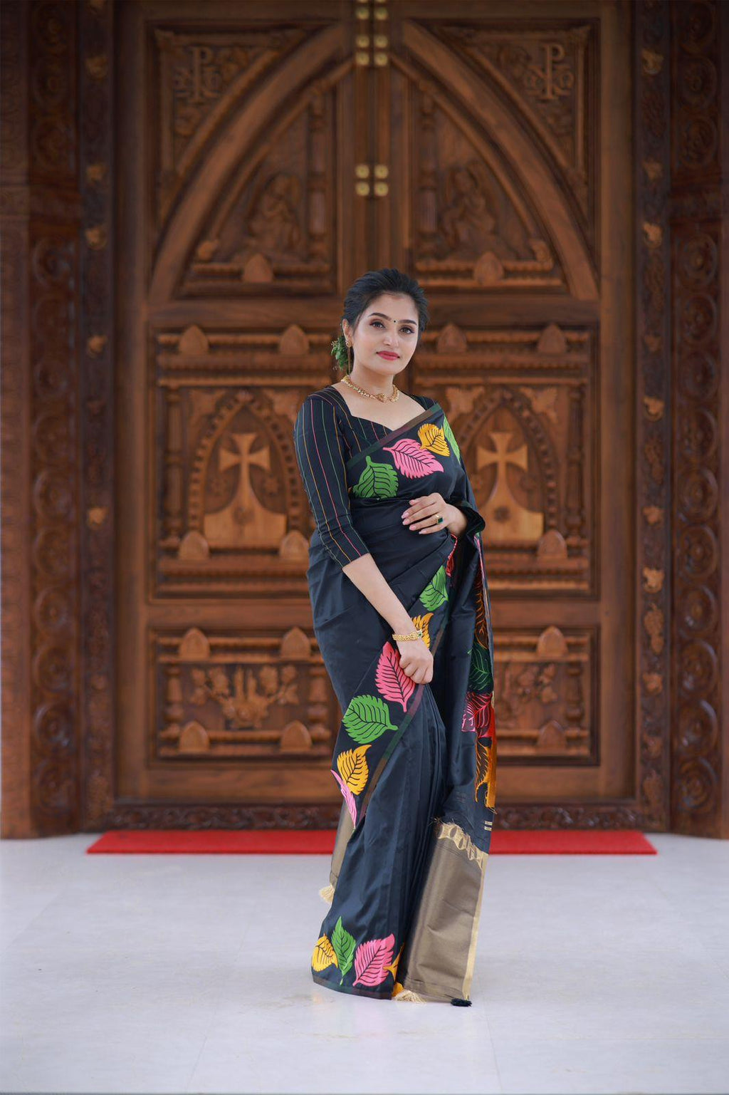 Black pure silk saree with multicolour leaf patterns and zari pallu