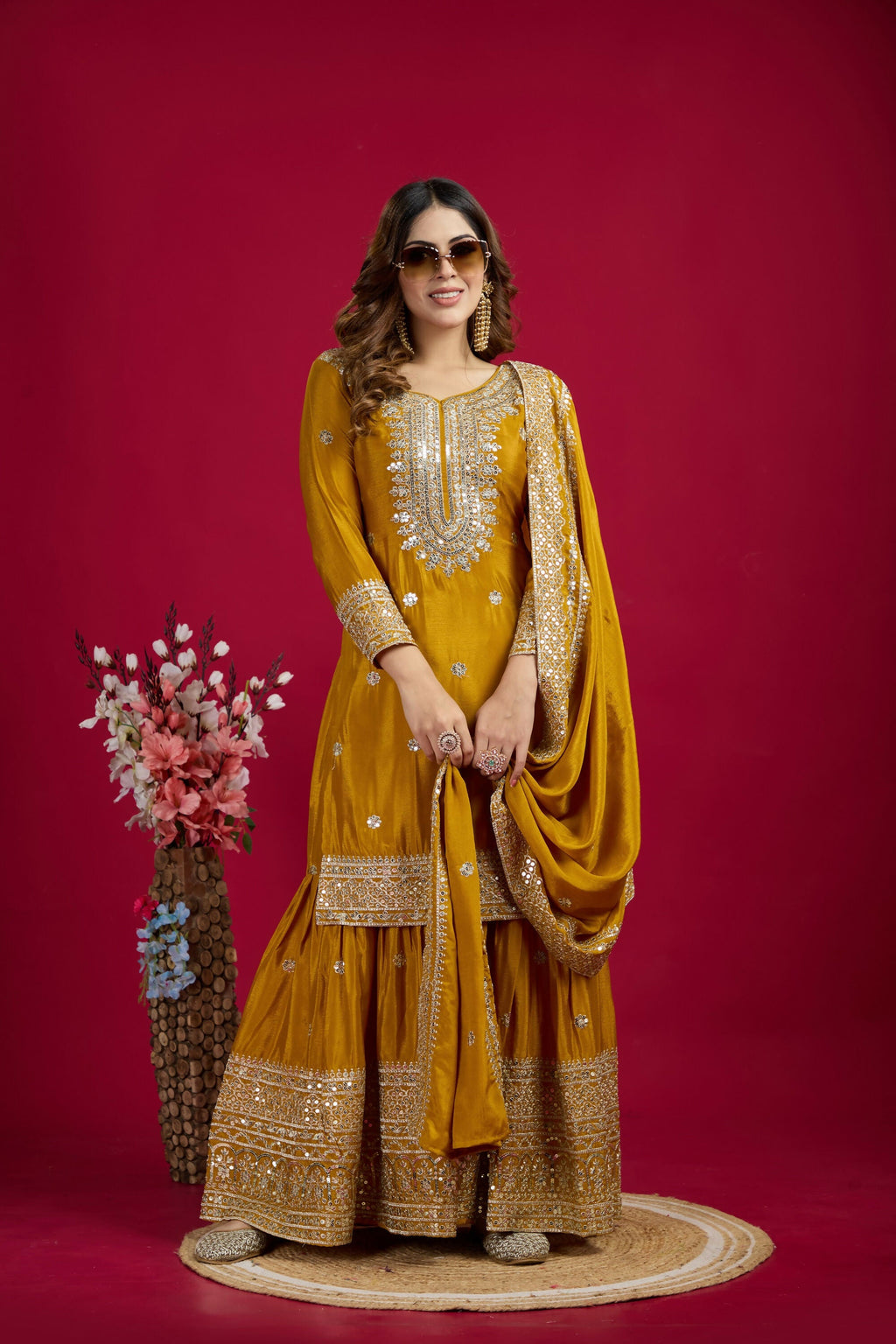 Vibrant yellow silk kurta set adorned with sequins, zari, and thread embroidery for festive events.