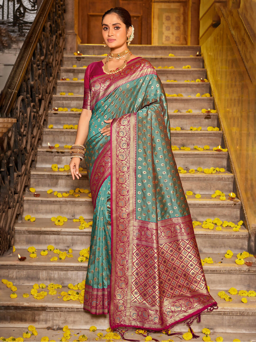 Sea Green Banarasi Silk saree paired with a contrasting magenta blouse piece.