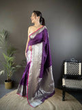 Elegant purple Banarasi soft silk saree adorned with intricate small butti work and unstitched blouse fabric.