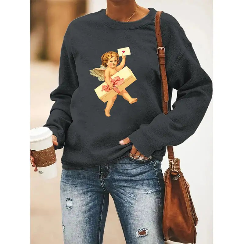 Woman wearing a charcoal grey crewneck sweatshirt with a cupid graphic print