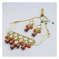 Kundan necklace set in gold, white, and maroon with traditional design