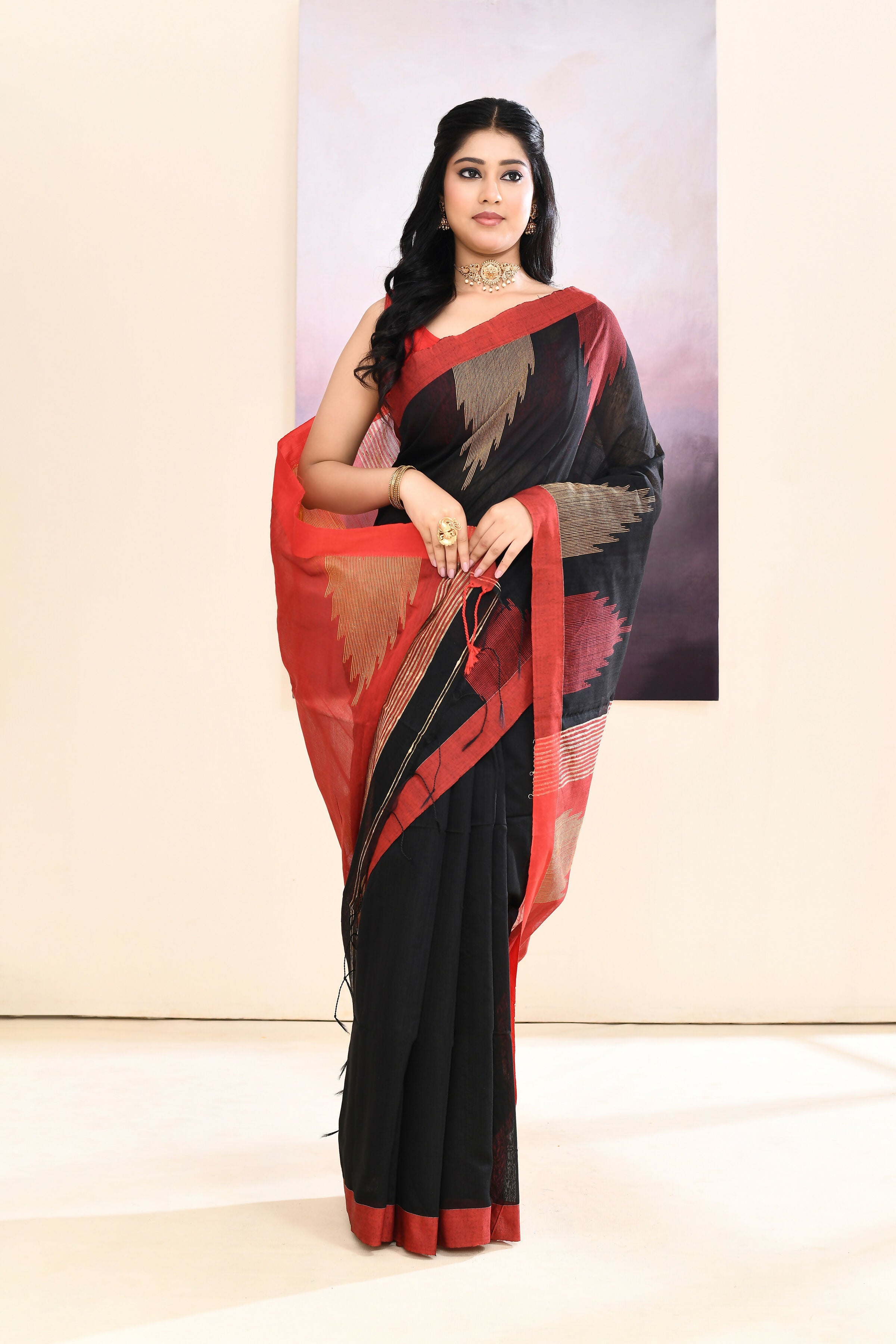 A beautiful Black Jamdani Saree featuring a traditional temple border design and fine embellishments.