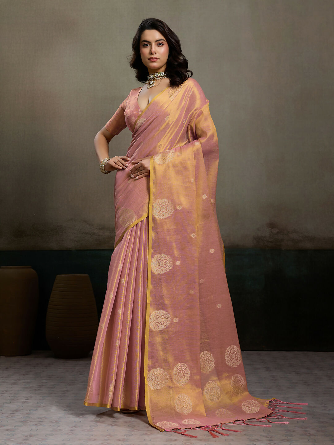 Light pink tissue silk saree with a matching light pink blouse