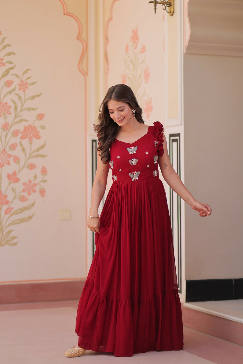 Maroon georgette gown featuring detailed sequence embroidery work