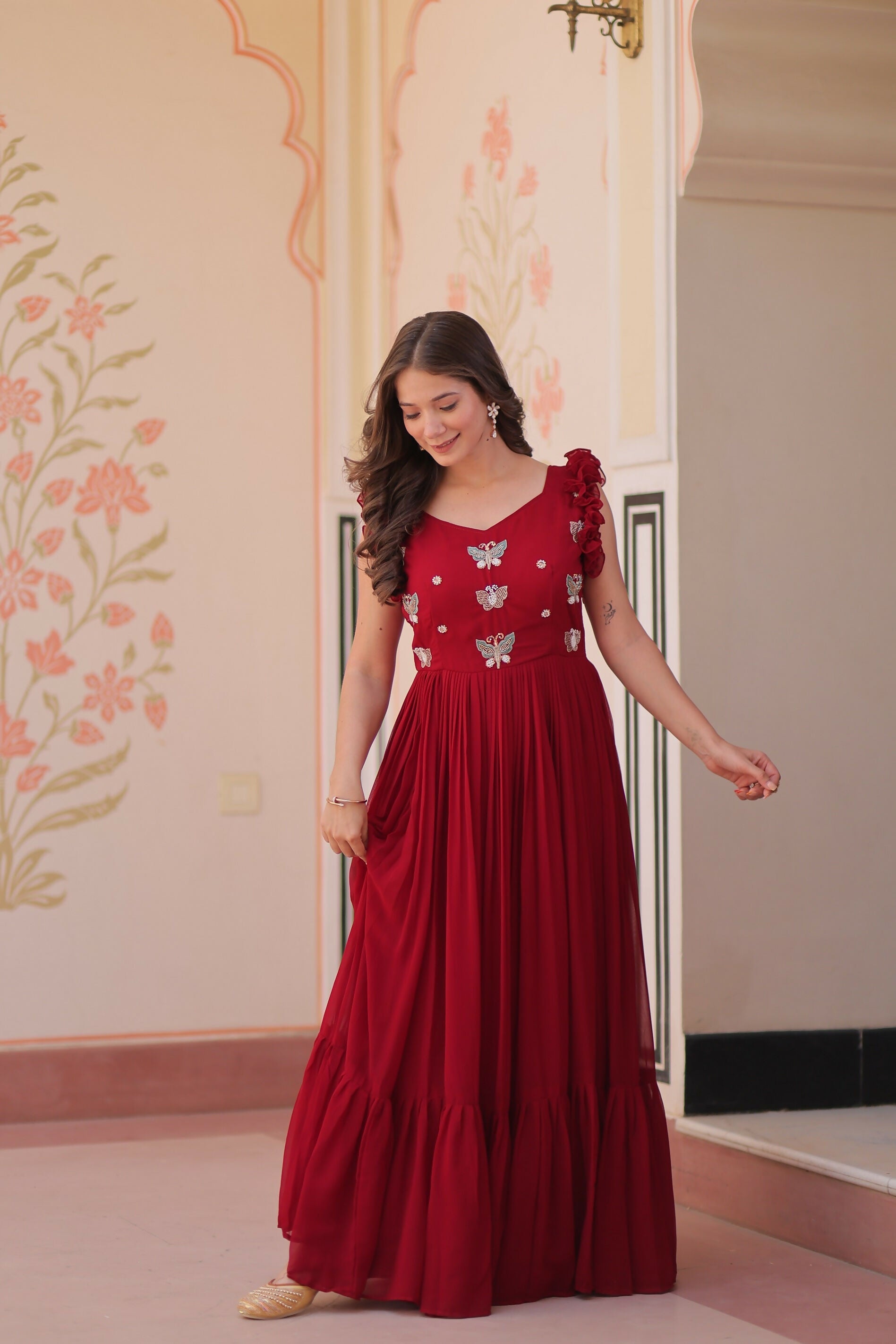 Maroon georgette gown featuring detailed sequence embroidery work