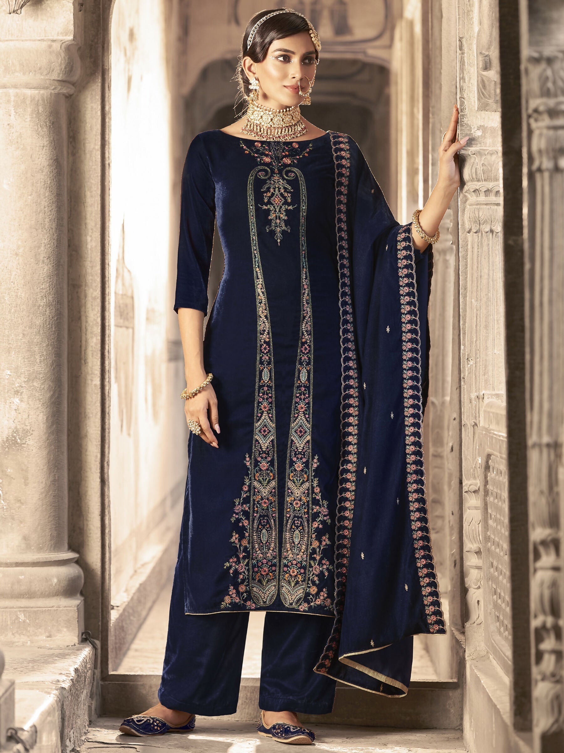 Navy Blue velvet straight kurta set with floral Resham thread and Jari embroidery, including trousers and dupatta.