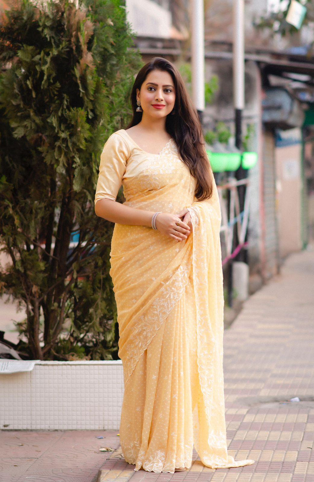 Yellow pure chiffon saree with white thread embroidery, cutwork, and matching phantom silk blouse