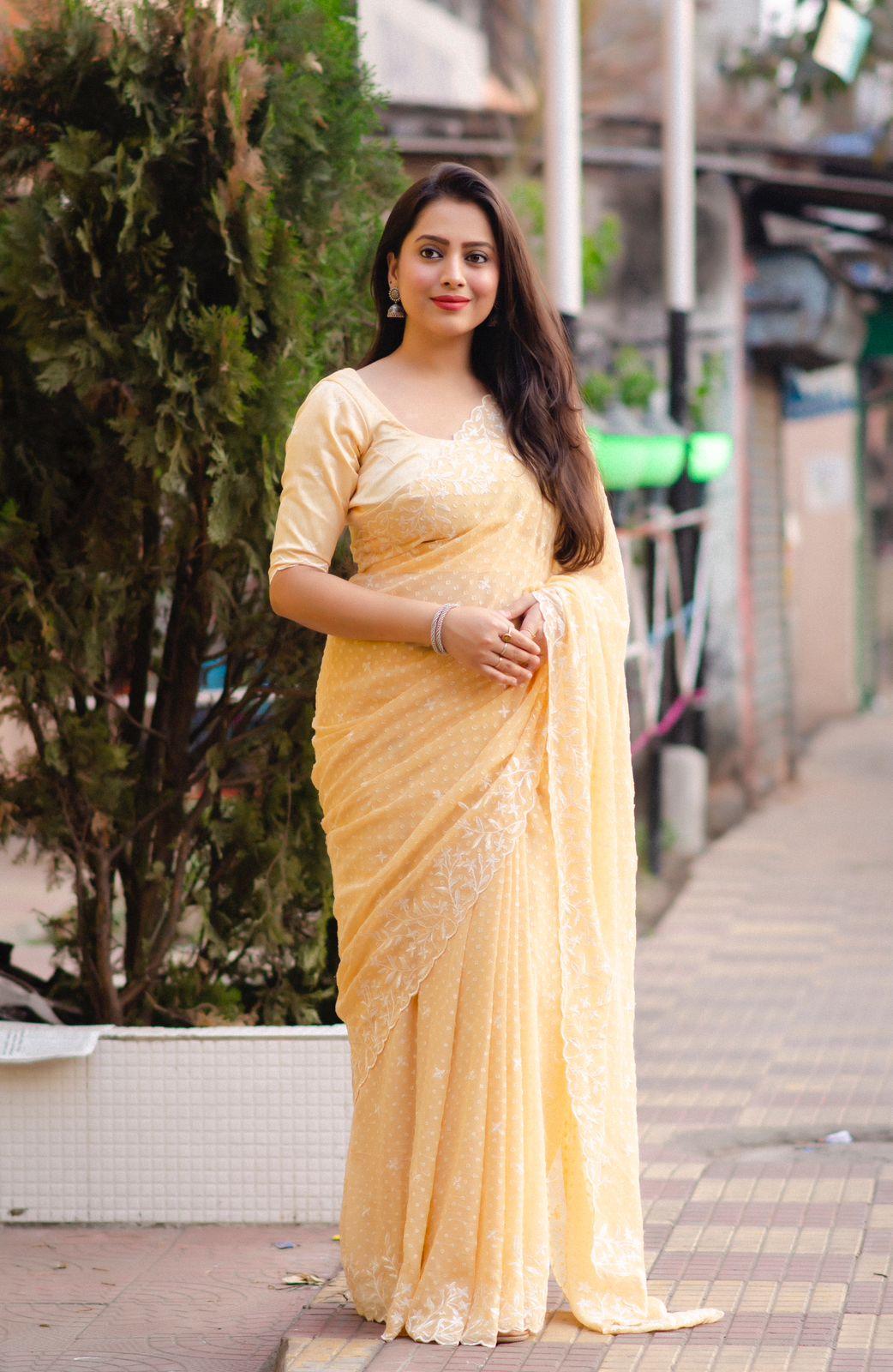 Yellow pure chiffon saree with white thread embroidery, cutwork, and matching phantom silk blouse
