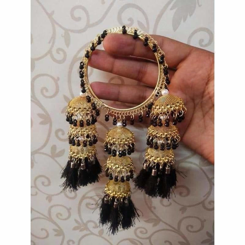 Gold tone bangles with black pearls and hanging black silk thread jhumkas