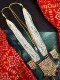 Maroon Kundan and Pearl necklace and earring set with traditional brass craftsmanship