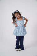 A two-piece set for girls featuring a blue floral chiffon balloon top with shoulder ties and matching flared trousers.
