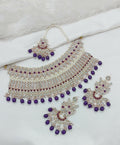 Regal purple stone work necklace set with intricate design and matching earrings