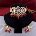 A beautiful handcrafted red Kundan necklace set with gold plated finish and adjustable cord.