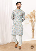 A boy wearing a bright multicolor printed cotton kurta set