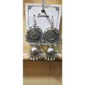 Silver Lord Ganesh jhumka earrings featuring hanging pearls and intricate traditional detailing.