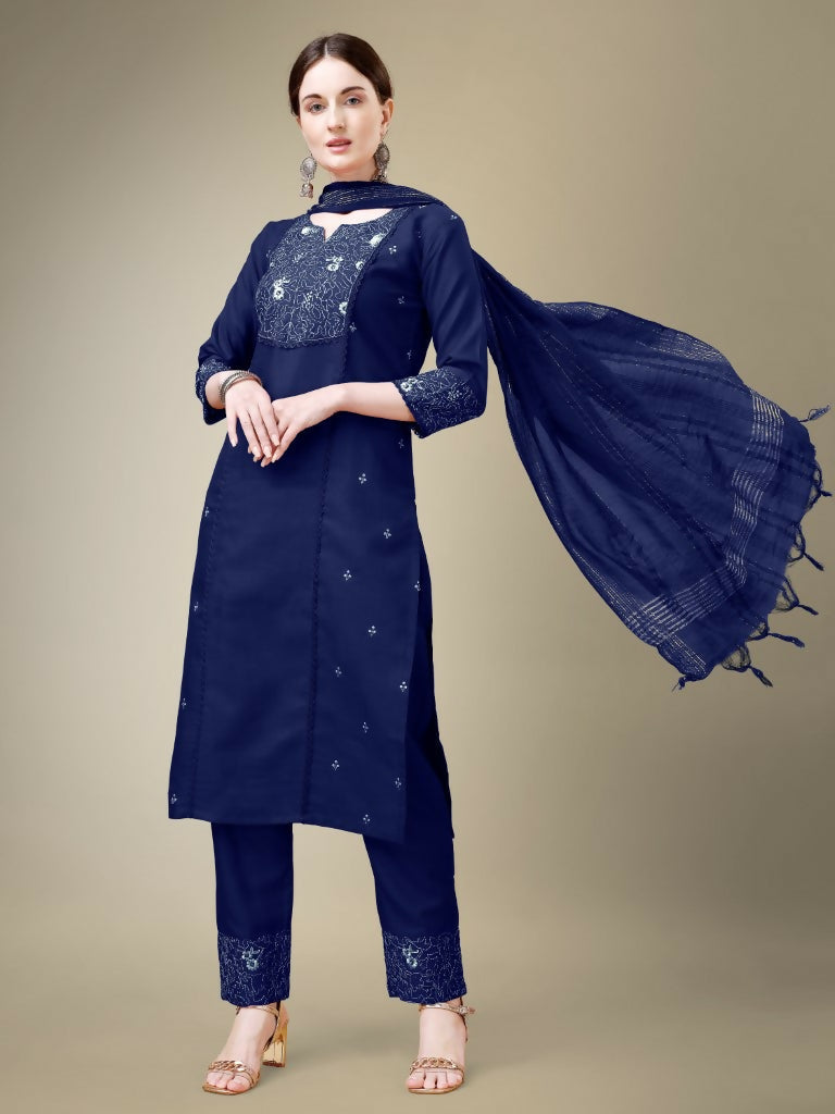 A woman wearing a Navy Blue cotton blend straight kurta with embroidery and fancy lace work, paired with trousers and a dupatta.