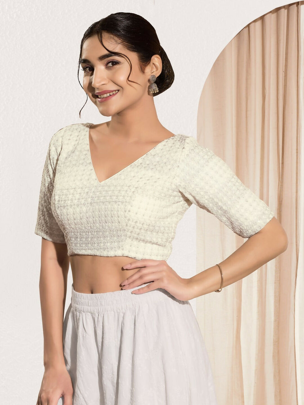 Off white crochet padded blouse with v-neck and elbow sleeves