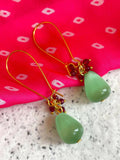 C Green Monalisa stone earrings with intricate Cheed detailing on a brass base.