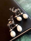 Silver deer motif oxidized brass earrings with a white pearl