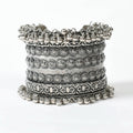 Close up of an intricate Joharkamal Oxidised Silver-Plated Ghungroo bracelet on a model's wrist