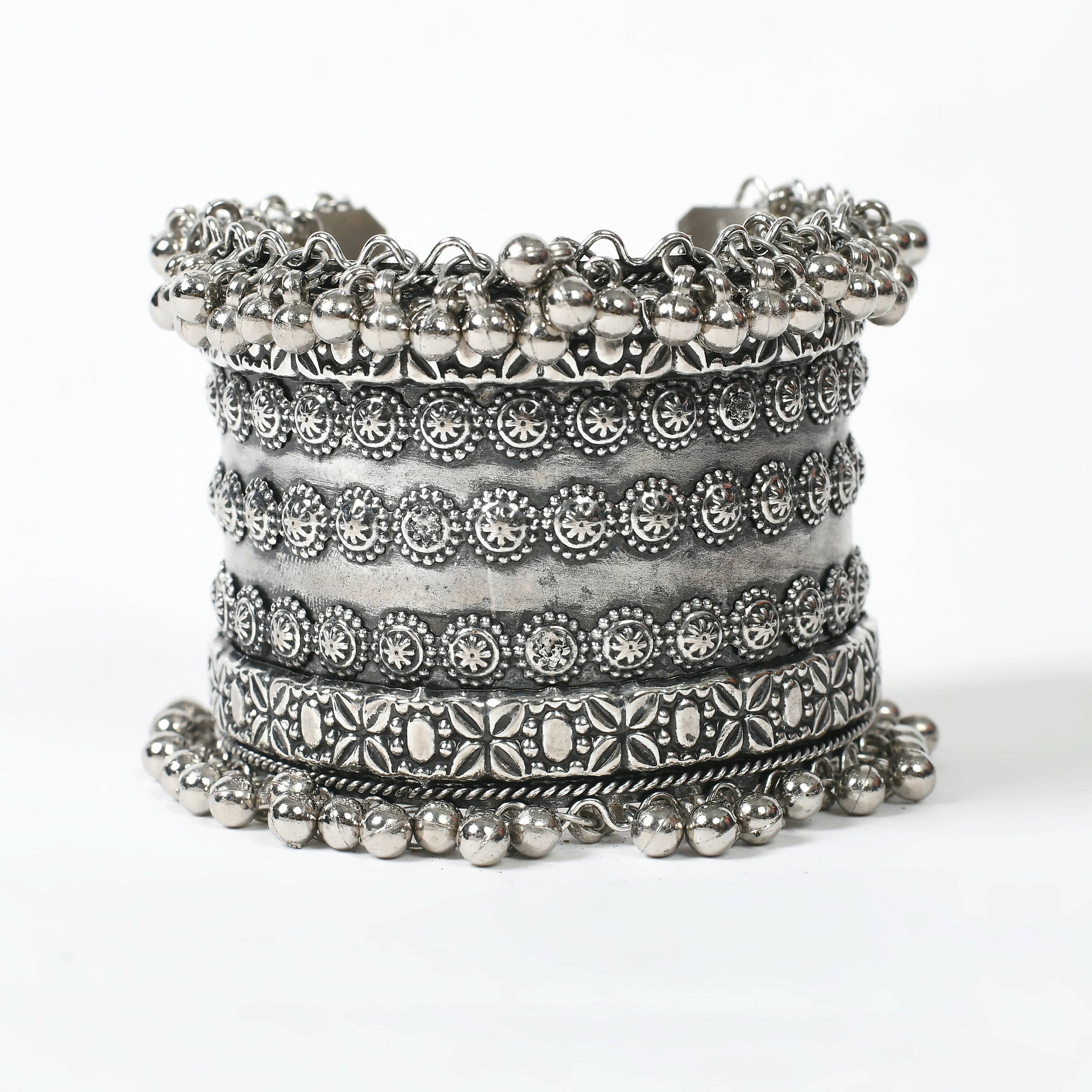 Close up of an intricate Joharkamal Oxidised Silver-Plated Ghungroo bracelet on a model's wrist