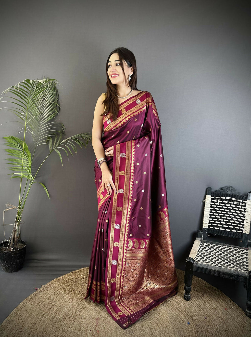 Maroon Banarasi Soft Silk saree with elegant traditional woven work.