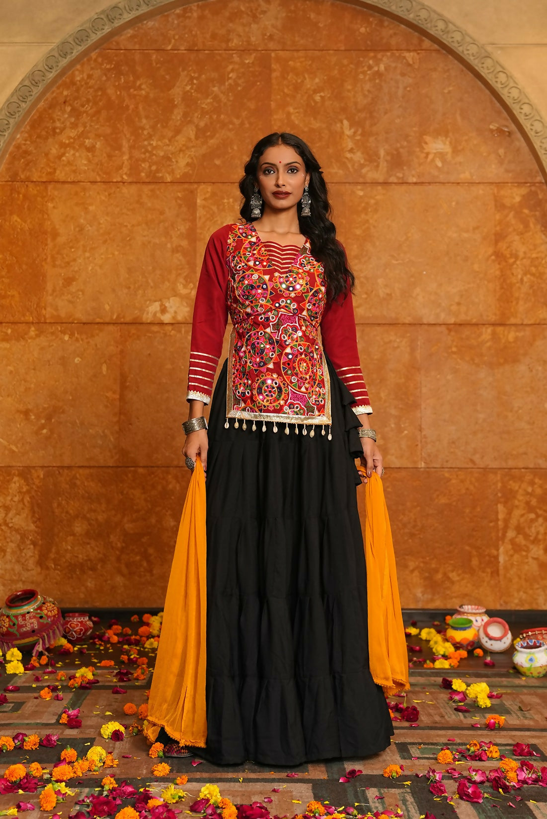 Black crepe lehenga choli with red blouse and yellow dupatta for Navratri
