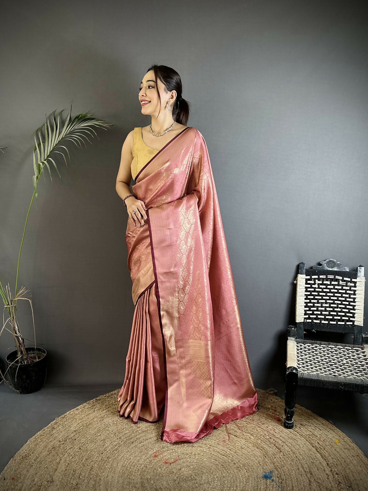 Rose gold soft satin silk Banarasi saree with paisley and floral patterns