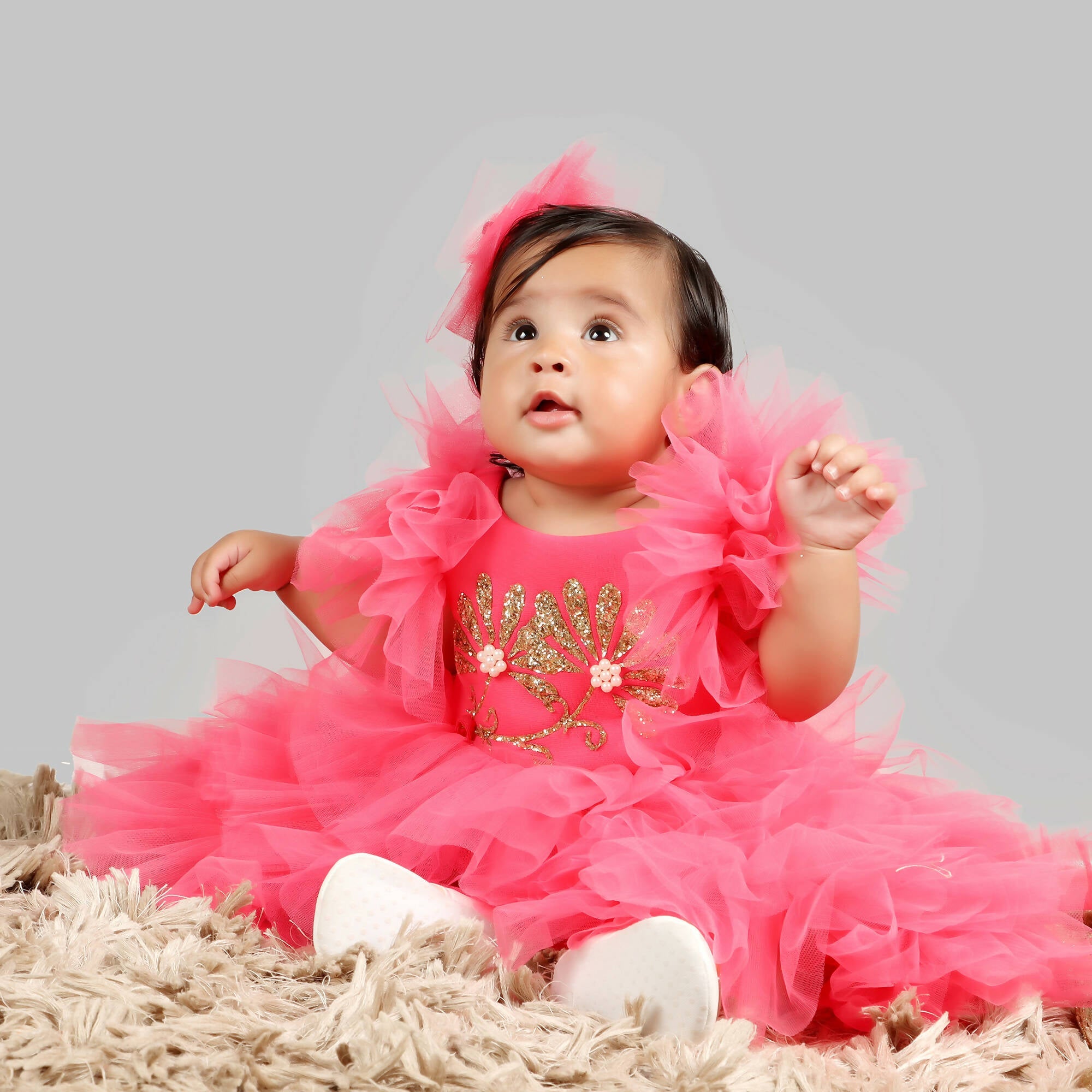 Pink Scuba Bodice Gown with Frill Sleeves and Net Ghera