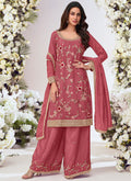 A front view of a peach Chinon silk palazzo suit with intricate embroidery and gota patti work