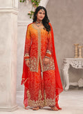 Close-up of Orange Premium Chinon fabric with heavy embroidery and hand-work details