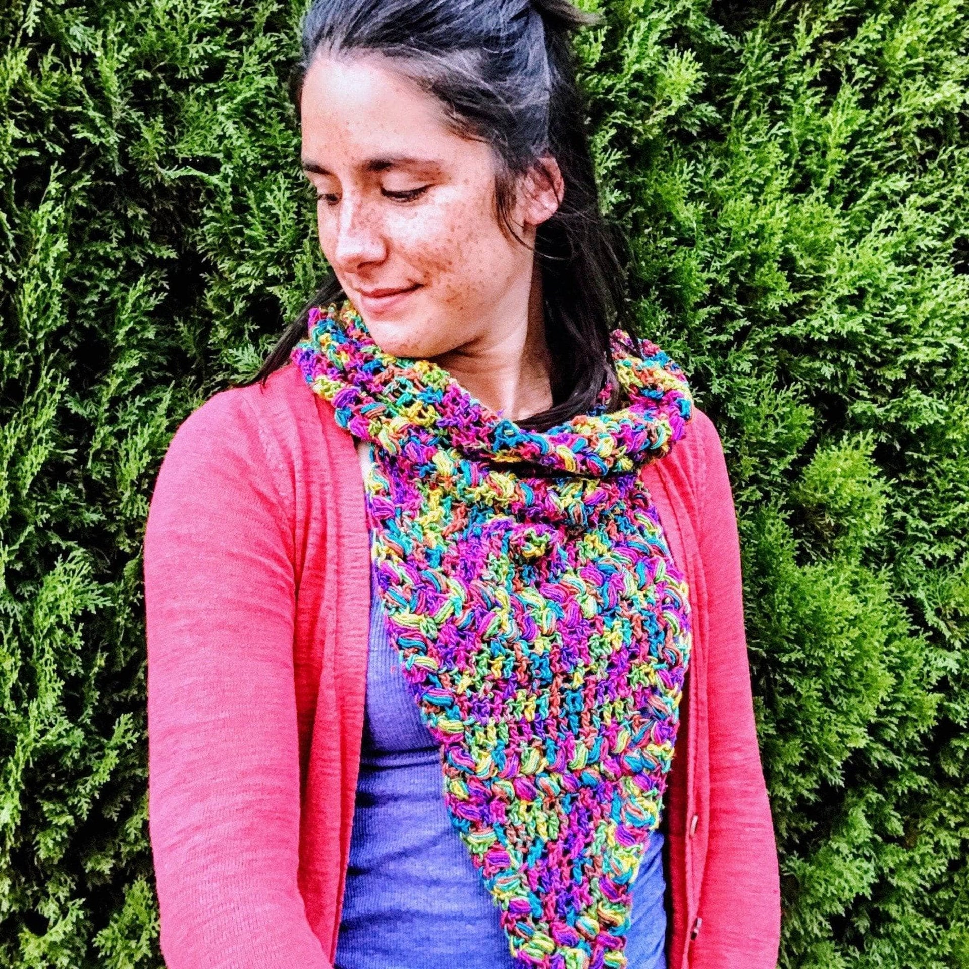 Close up of the Rainbow Meadows Cowl Crochet Kit featuring vibrant multi-colored yarn with metallic flecks