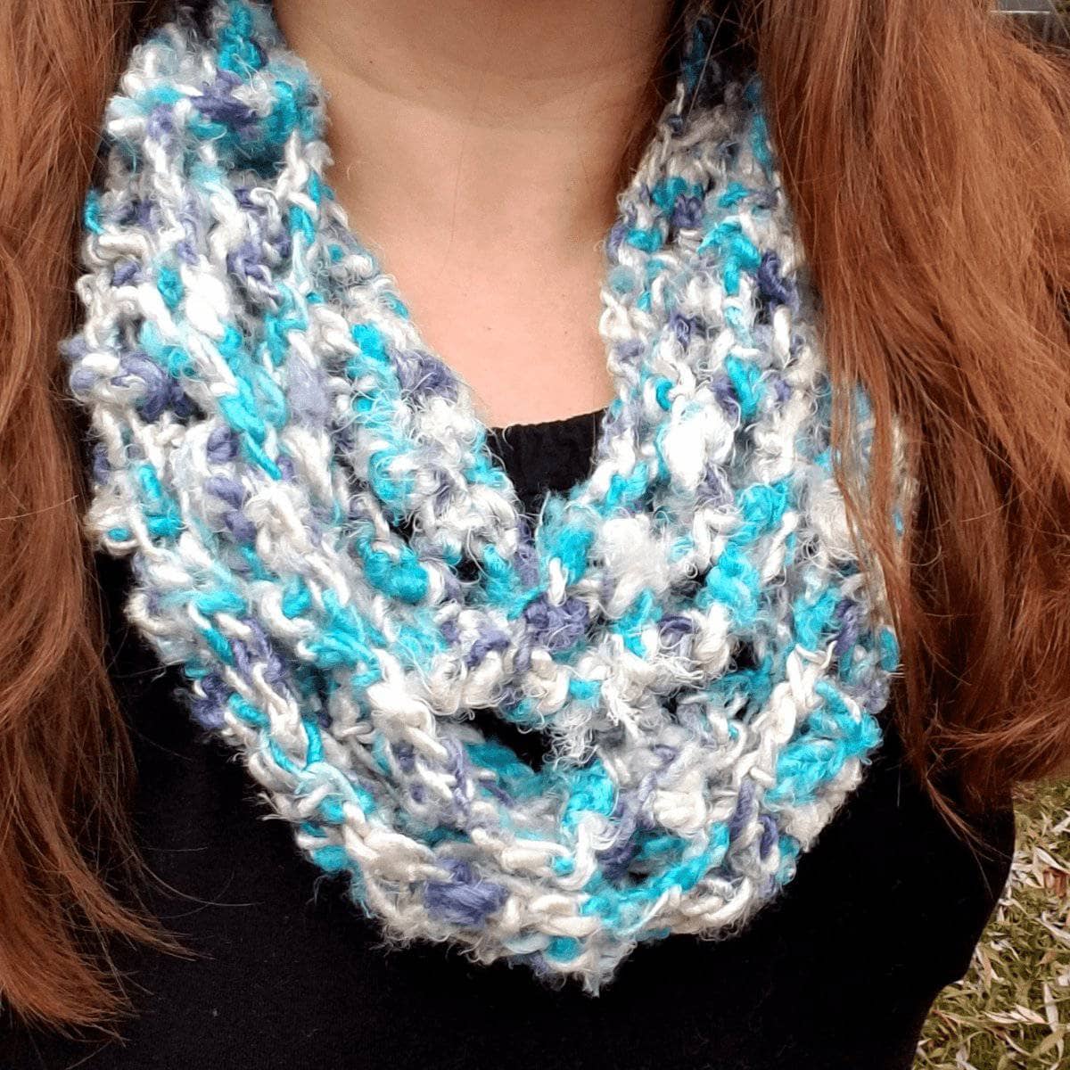 Rainy Day Infinity Scarf Crochet Kit featuring blue, white, and teal banana fiber yarn