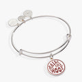 Expandable wire bangle featuring a silver and maroon Raise the Woof dog charm.